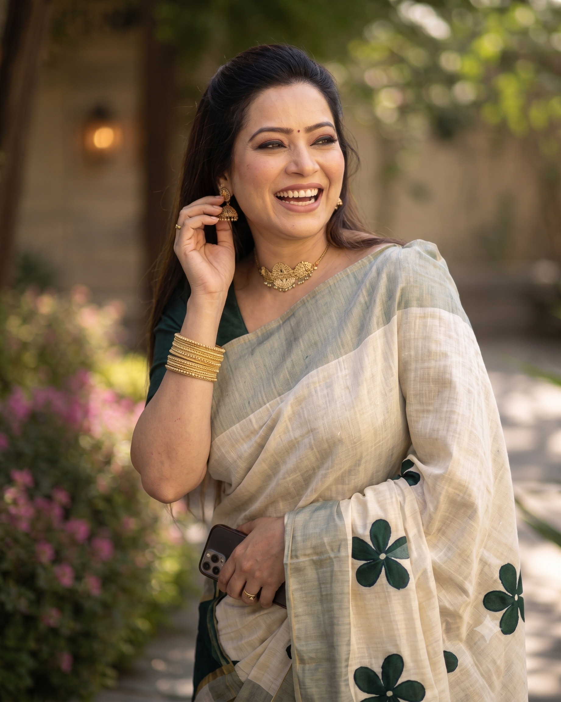 Green flower embroidered golden tissue saree with tussles