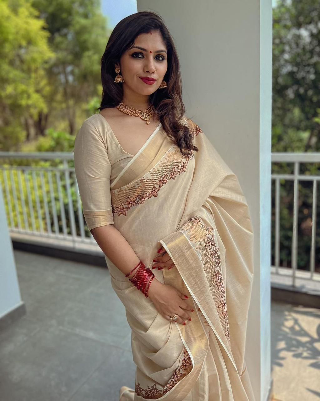Flower shed golden tissue embroidered saree