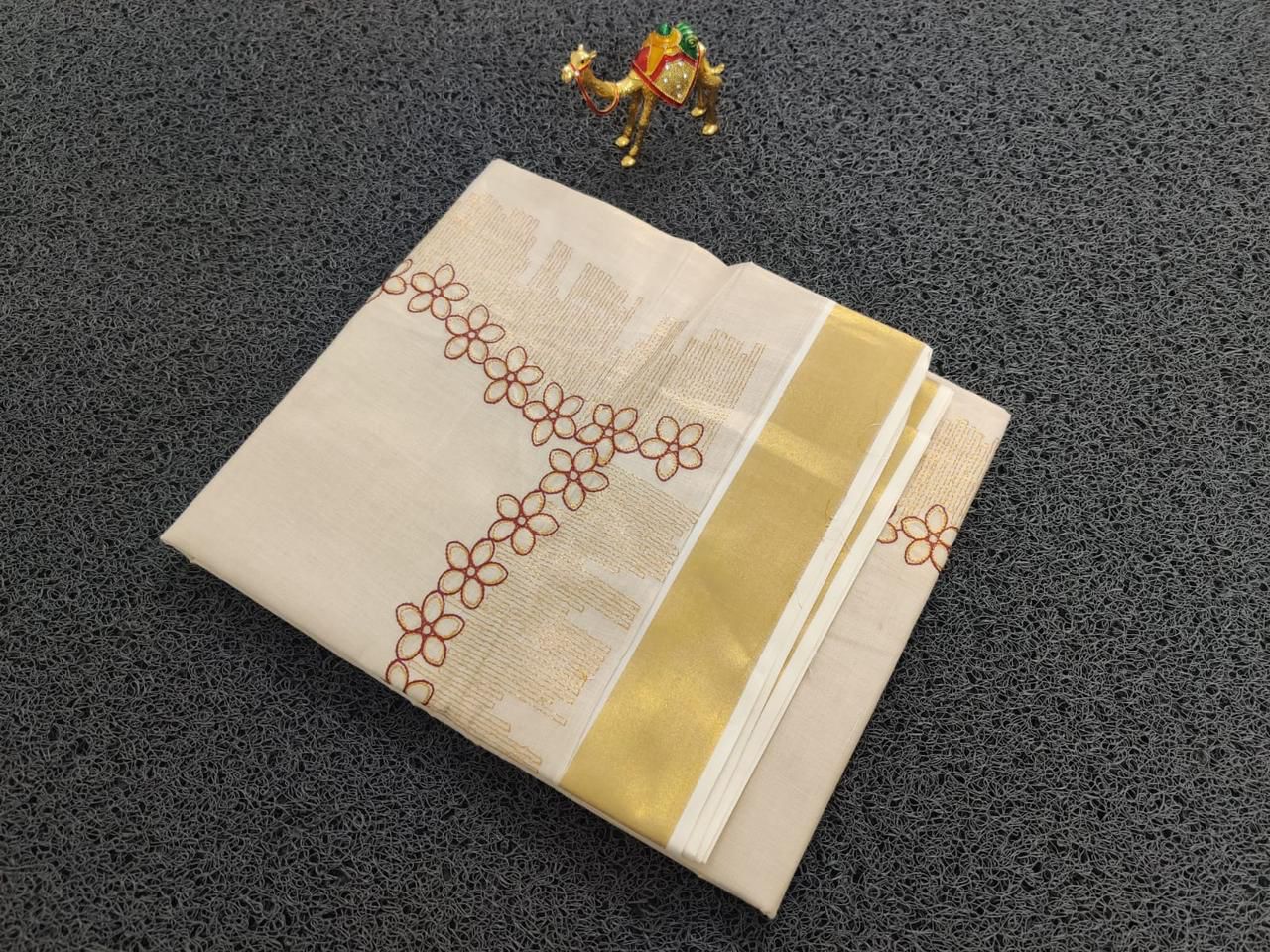 Flower shed golden tissue embroidered saree